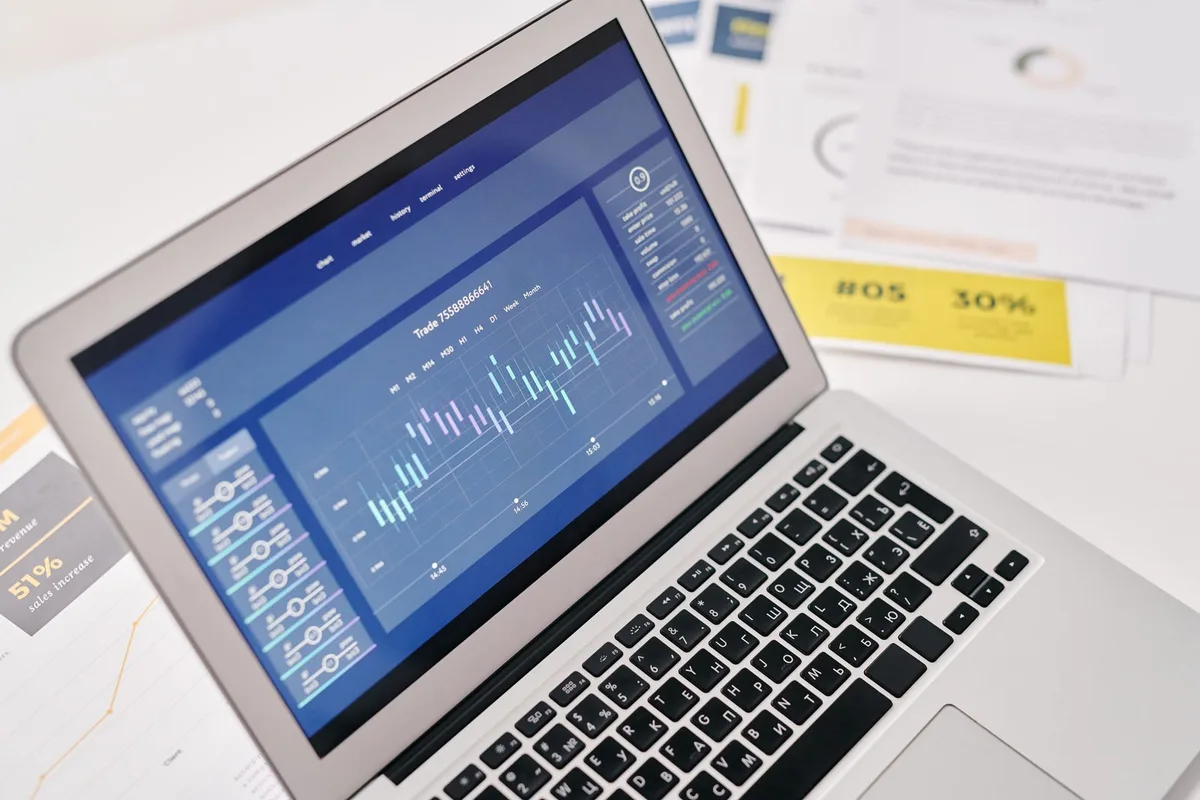 Financial analysis software and reports displayed on a laptop